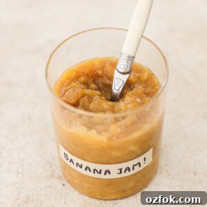 Vegan Homemade Banana Jam Recipe: Simple Step-by-Step Guide 8 banana jam in a glass jar with a white spoon