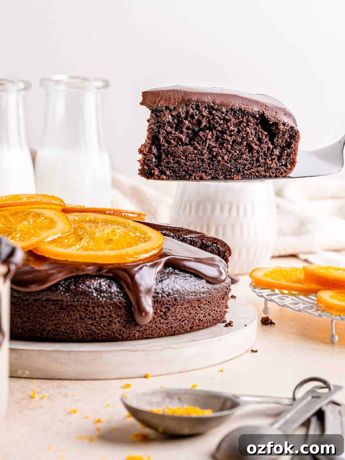 Lifting a slice of moist cake with a cake server.