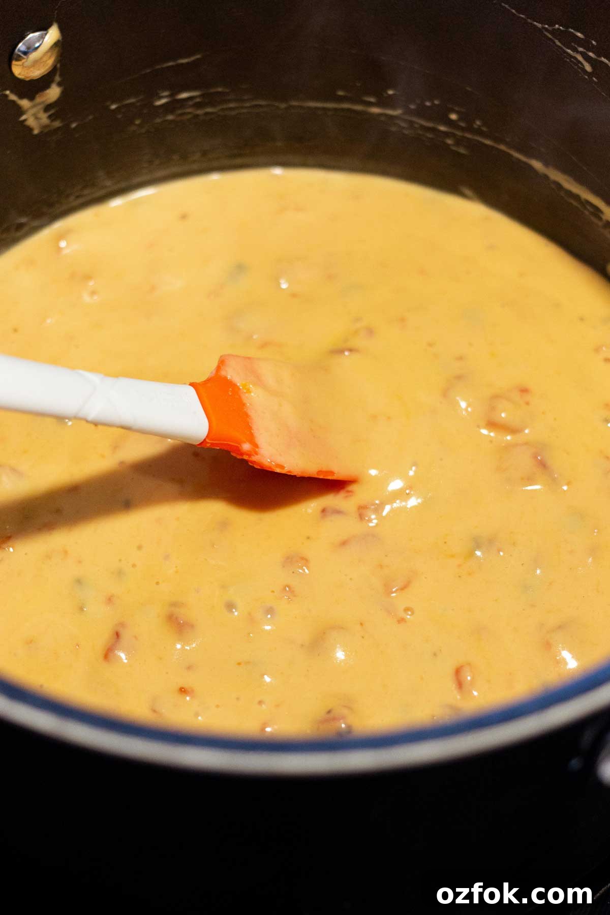 Creamy Rotel Chicken Spaghetti with Velveeta Cheese 5 Rotel Velveeta creamy cheese mixture melted in a large pot.