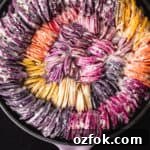 Crispy Hasselback Potato Gratin: Creamy Layered Comfort Dish 10 Rainbow root veggies including carrots, beets, potatoes, sweet potatoes, radishes and parsnips made into a very colorful hasselback gratin; proven shot.