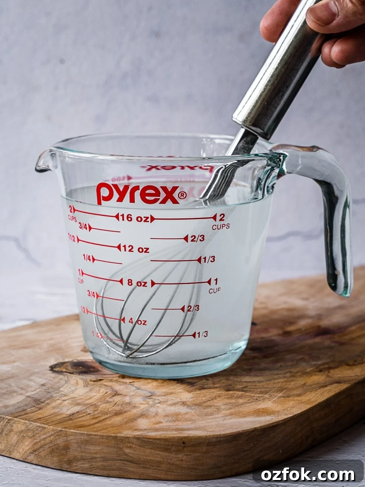 Recipe step showing the mixing of the vinegar solution.