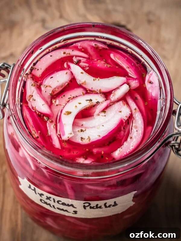 An opened jar of pickled Mexican onions with a label on a wooden board.