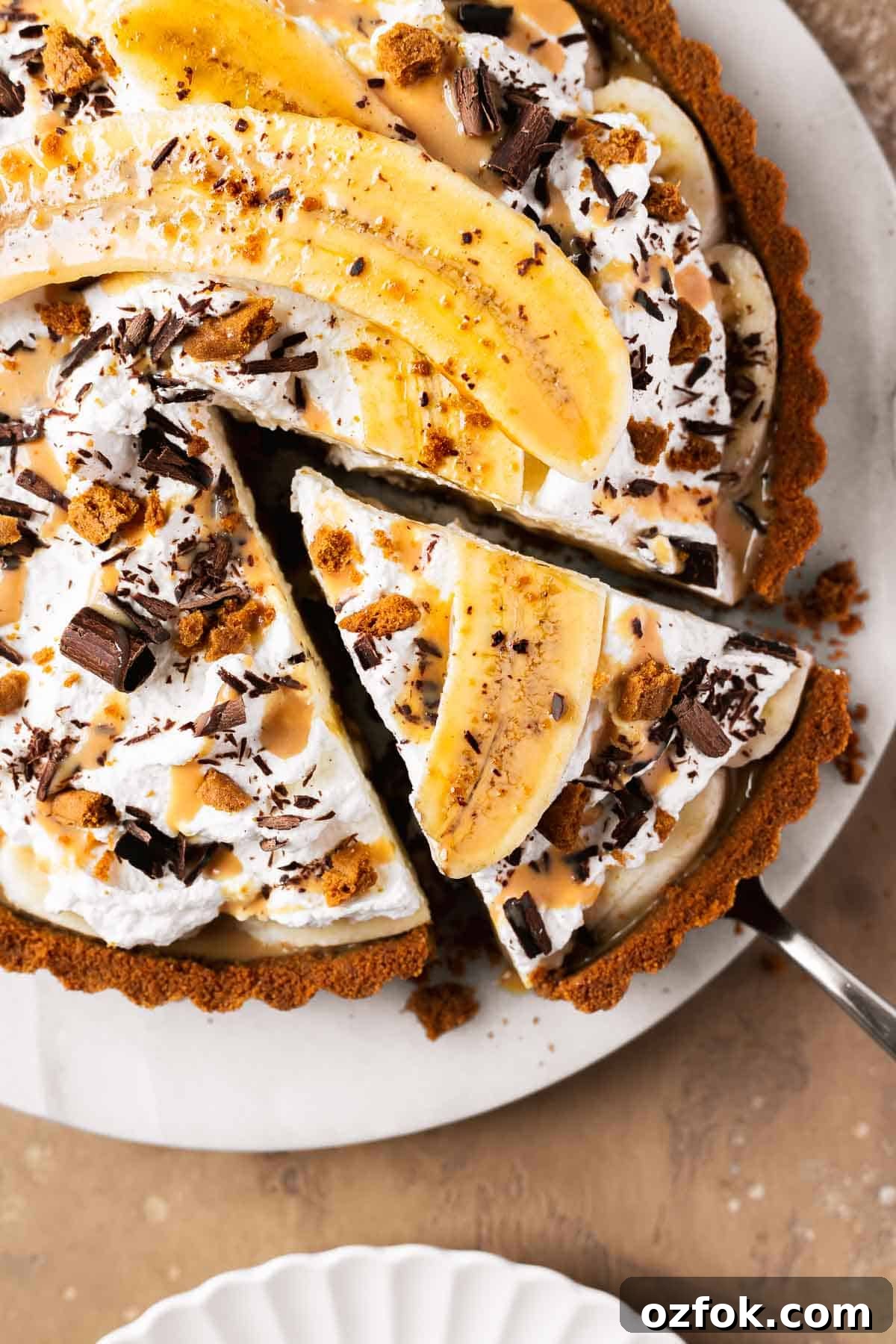 Banoffee Tart Recipe: Caramelized Banana Tart with Buttery Crust 13 A slice of dulce de leche banana tart.