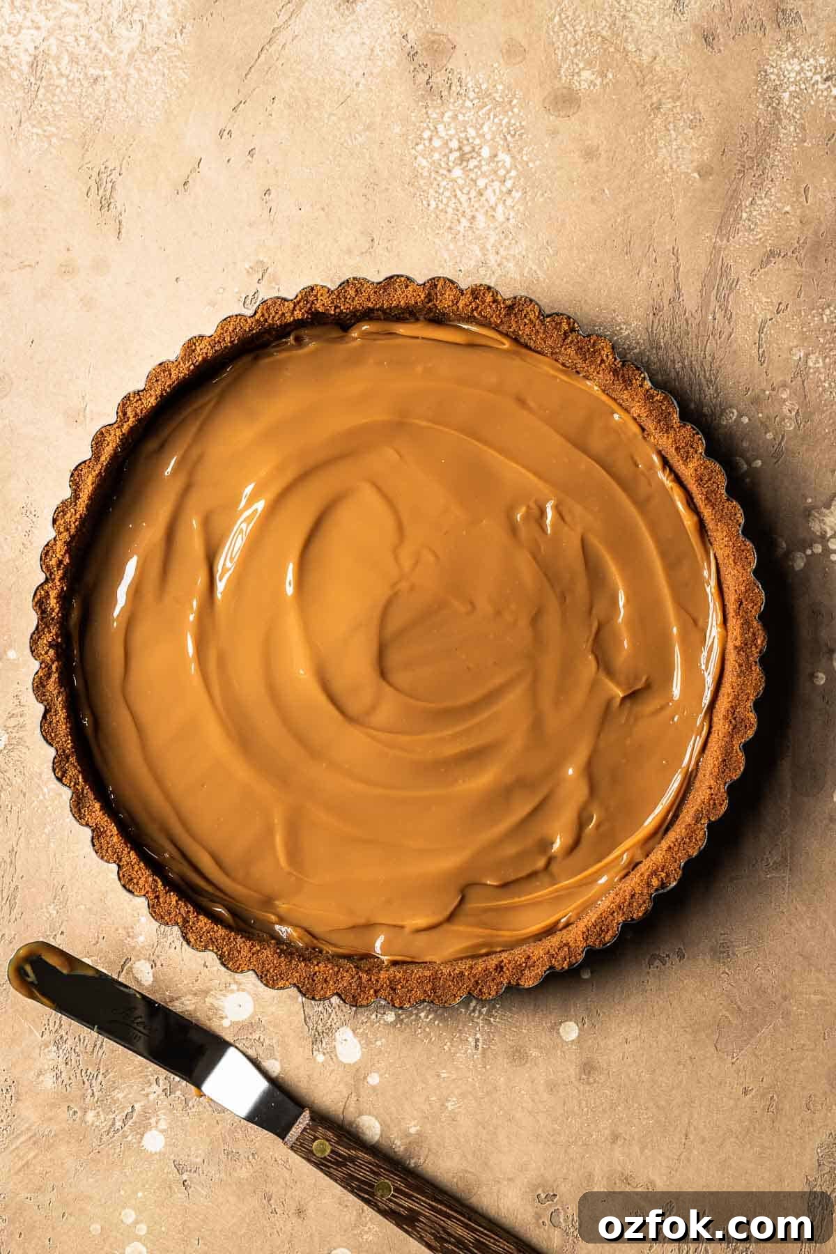 Banoffee Tart Recipe: Caramelized Banana Tart with Buttery Crust 6 Dulce de leche in the base of a biscoff crust.
