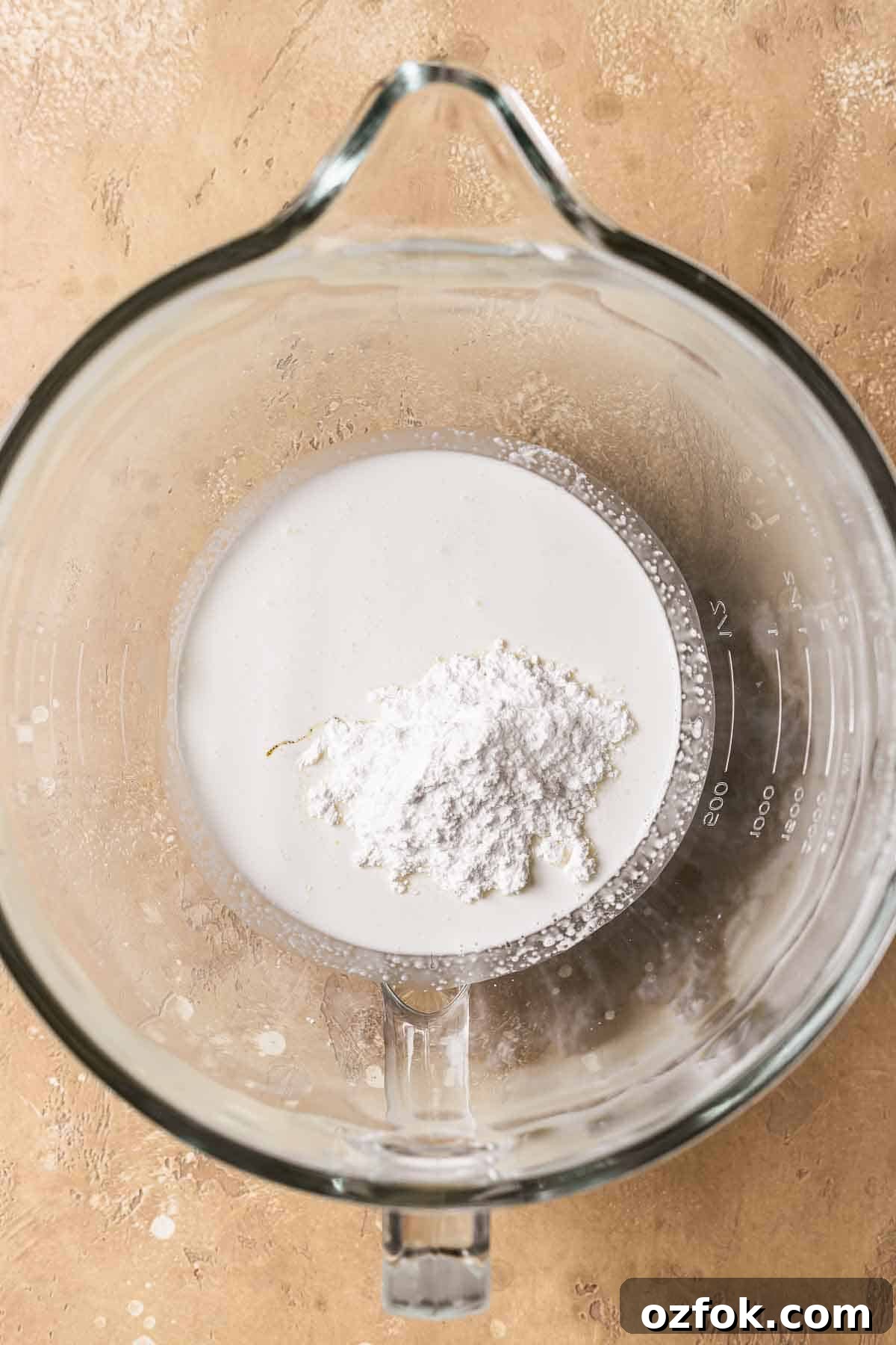 Banoffee Tart Recipe: Caramelized Banana Tart with Buttery Crust 8 Heavy cream, powdered sugar and vanilla in a glass mixing bowl.