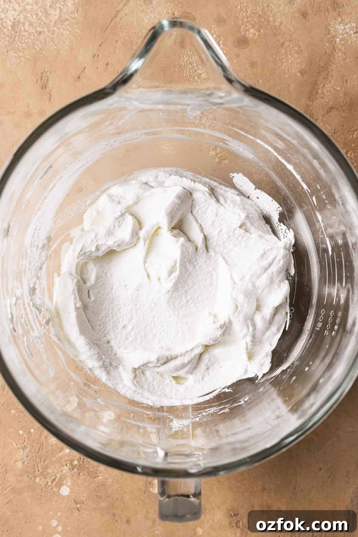 Banoffee Tart Recipe: Caramelized Banana Tart with Buttery Crust 9 Sweetened whipped cream in a mixing bowl.