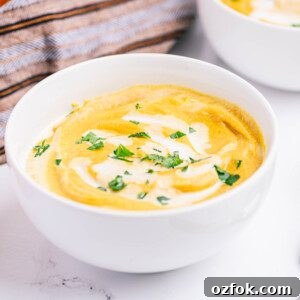 Creamy Pumpkin Soup Recipe with Warm Spices and Garlic Croutons 4 creamy pumpkin soup in a bowl