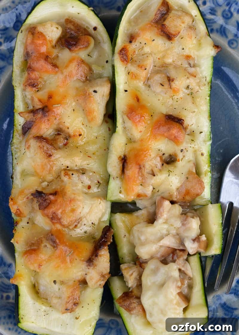 Chicken Alfredo Zucchini Boats Recipe for Low-Carb Dinners 8 Baked stuffed zucchini on a serving plate