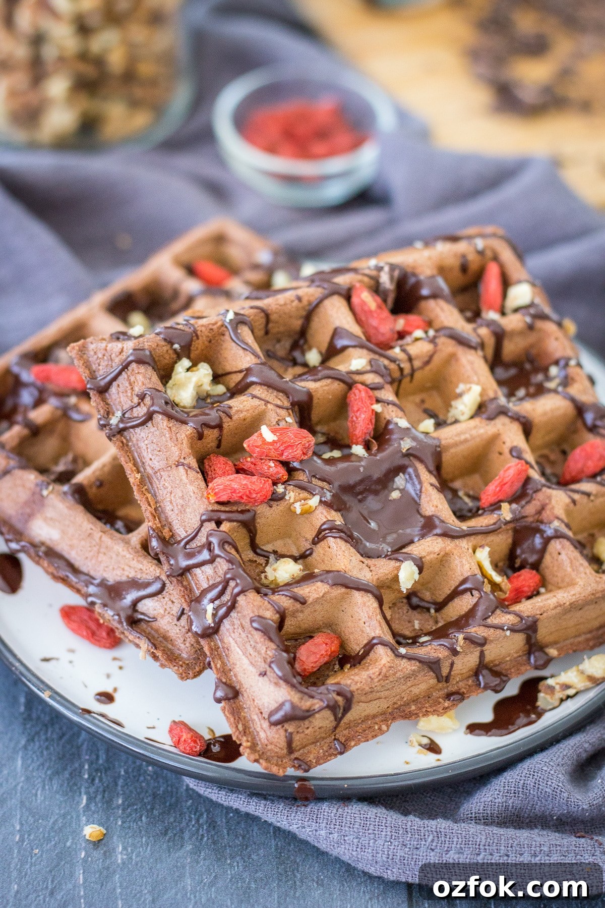 Decadent Chocolate Waffle Recipe for Breakfast or Dessert 4 Close up view of Chocolate waffles served on a plate drizzled with melted chocolate