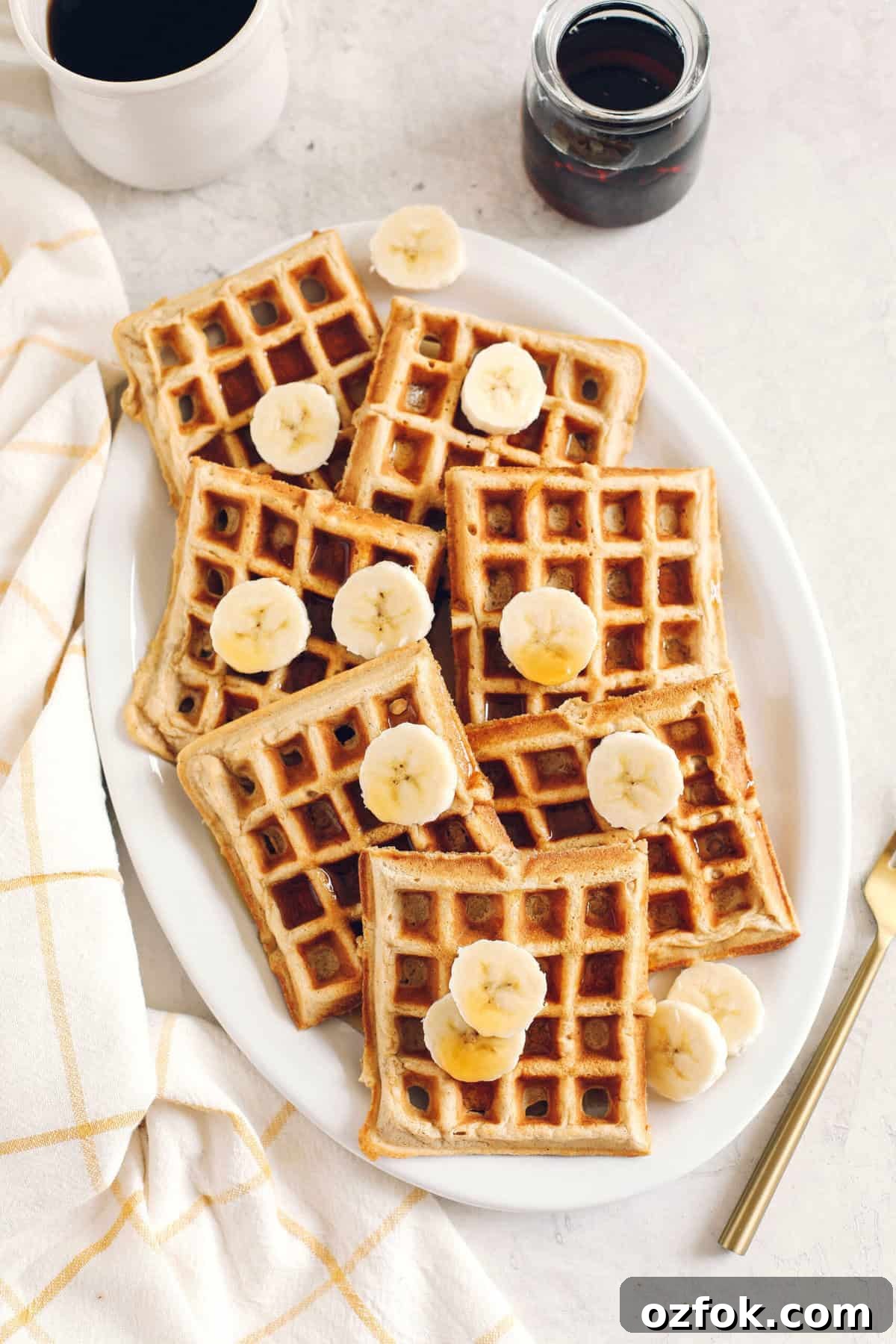Light and fluffy Whole Wheat Banana Waffles with perfectly crisp edges, warm spices and made with zero refined sugar for the perfect healthy morning breakfast!