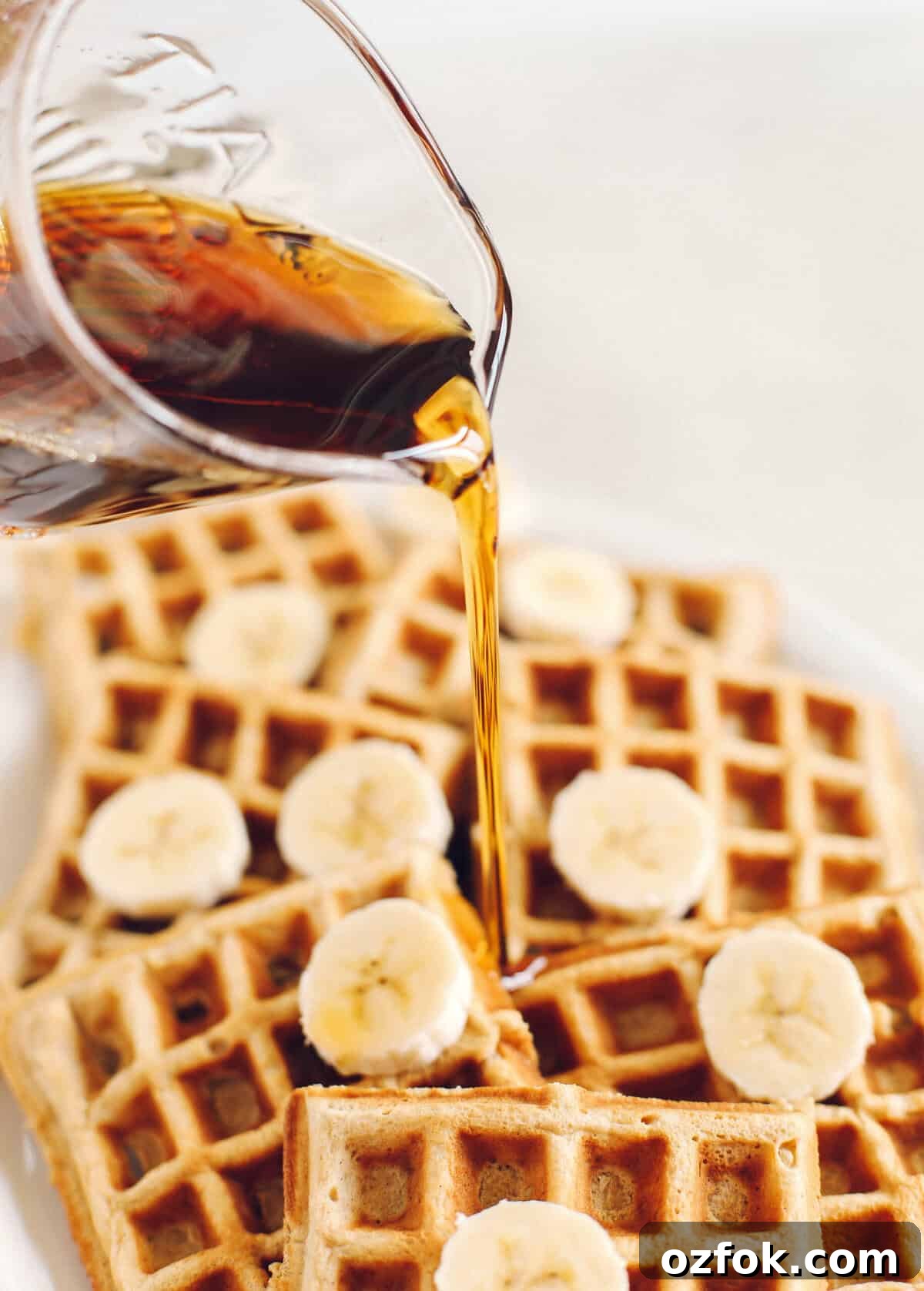 Light and fluffy Whole Wheat Banana Waffles with perfectly crisp edges, warm spices and made with zero refined sugar for the perfect healthy morning breakfast!