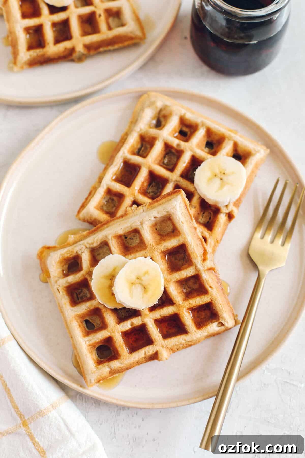 Light and fluffy Whole Wheat Banana Waffles with perfectly crisp edges, warm spices and made with zero refined sugar for the perfect healthy morning breakfast!