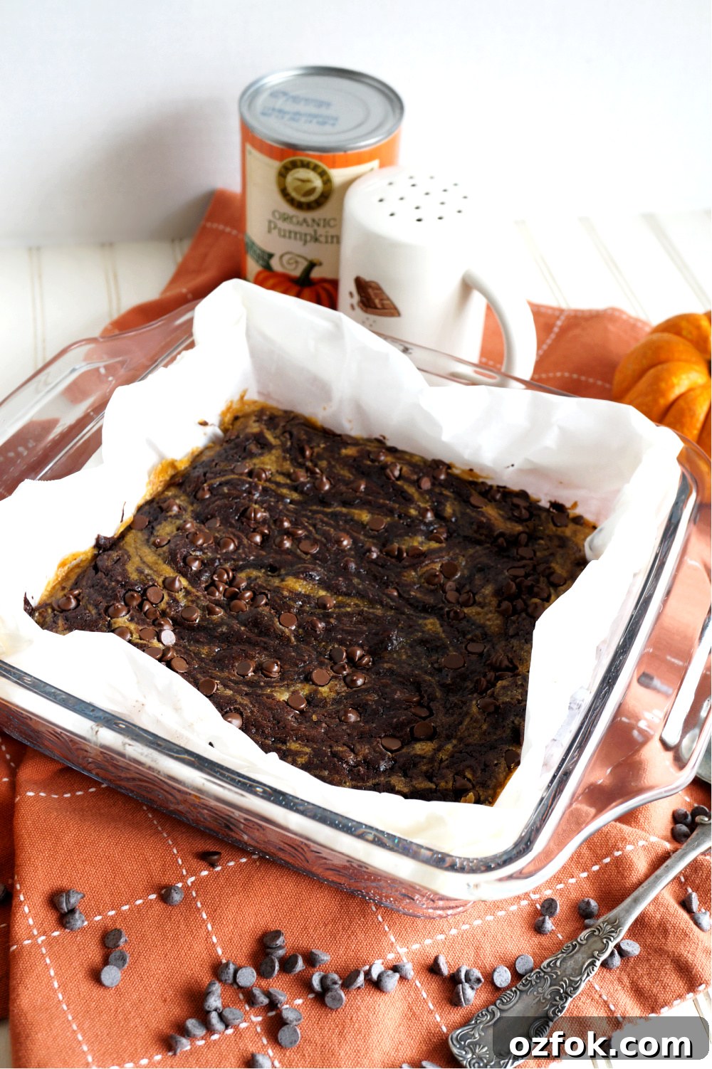 Vegan Pumpkin Swirl Brownies Recipe — Moist & Decadent 3 vegan pumpkin swirl brownies in pan