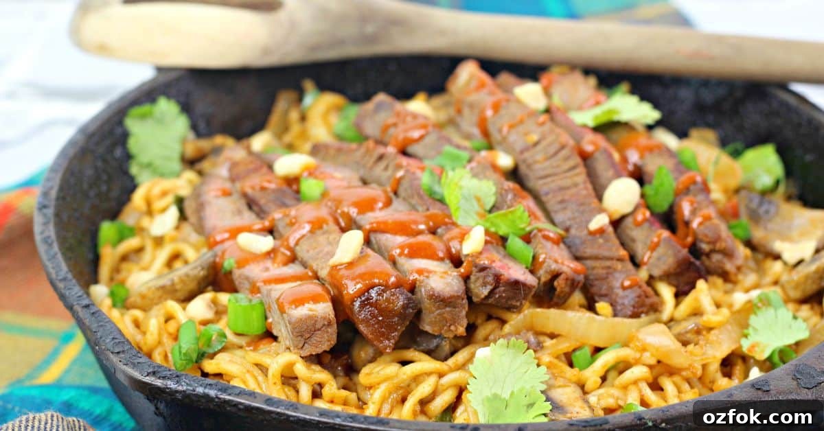 Spicy Korean Noodles Recipe — Authentic Bibim Guksu Guide 3 A close up of the pan of noodles and beef.