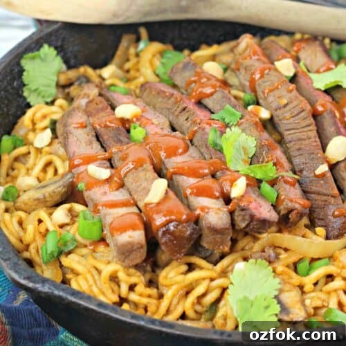 Spicy Korean Noodles Recipe — Authentic Bibim Guksu Guide 7 A pan of the korean spicy noodles with steak.