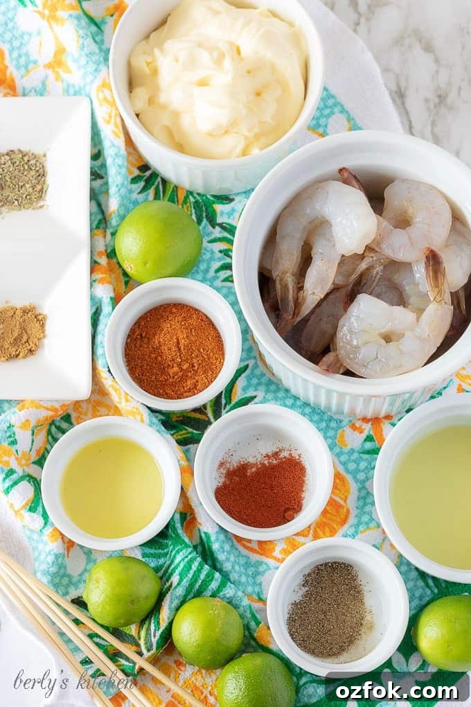 Key Lime Grilled Shrimp with Creamy Aioli Sauce 3 Grilled shrimp ingredients like key lime juice, olive oil, and seasonings in small white bowls.