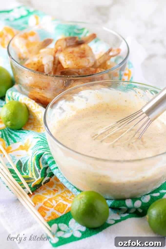 Key Lime Grilled Shrimp with Creamy Aioli Sauce 4 Two glass mixing bowls—one with key lime aioli and one with seasoned raw shrimp.
