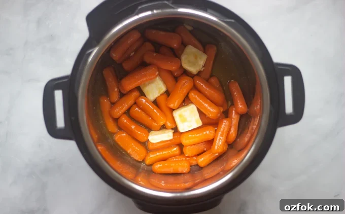 Instant Pot Honey-Glazed Carrots (Video) 5 Instant pot with carrots, oj, butter and sugar