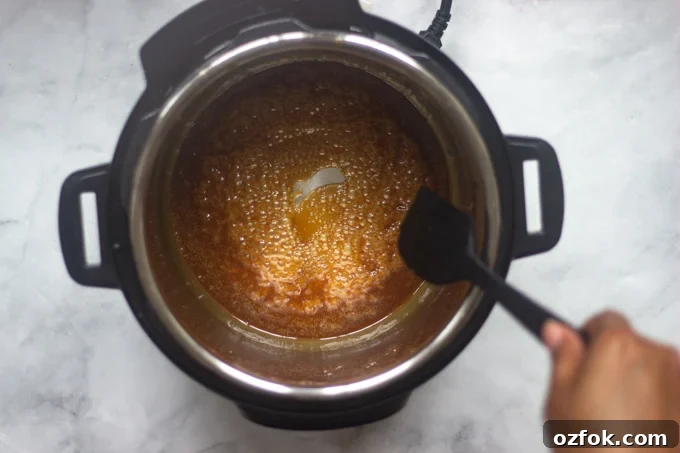 Instant Pot Honey-Glazed Carrots (Video) 8 An instant pot with glaze for candied carrots