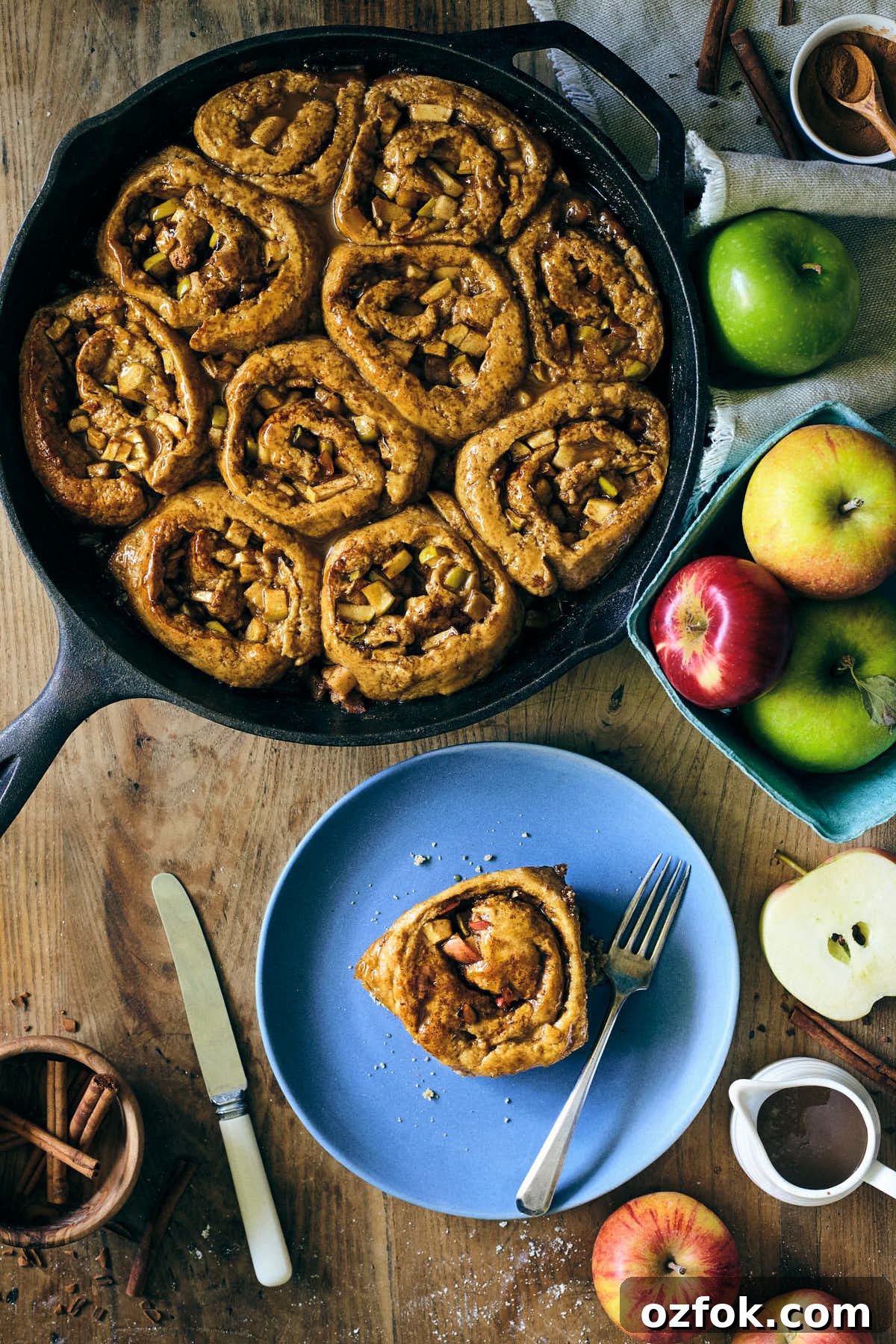 Caramel Apple Cinnamon Sticky Buns Recipe 2 Caramel Apple Sticky Cinnamon Bun on a blue plate with full batch side