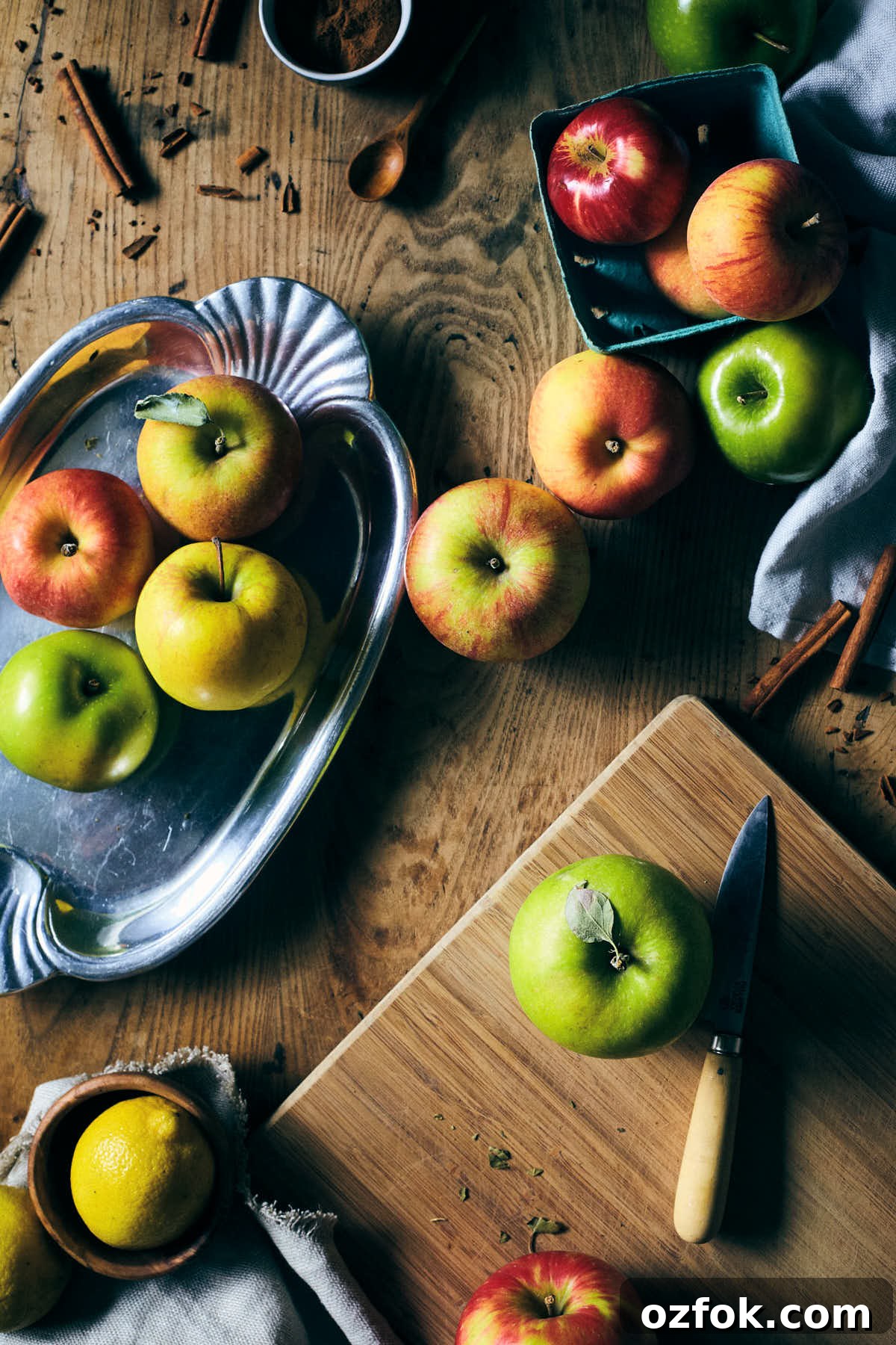 Caramel Apple Cinnamon Sticky Buns Recipe 3 Apples on a cutting board before being cut into filling