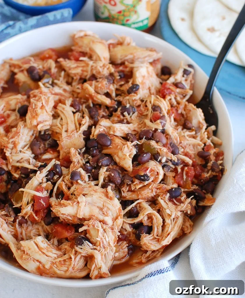 Juicy Slow Cooker Shredded Chicken Recipe for Meal Prep 5 Slow Cooker Shredded Chicken with teal napkin