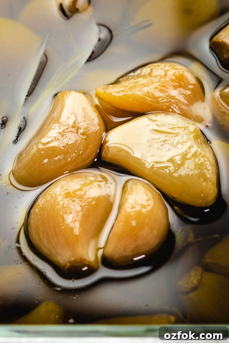 Garlic Confit and How to Make Homemade Garlic-Infused Oil 4 Garlic lovers rejoice: You can make homemade garlic confit and garlic oil with only a few minutes of prep time. Slowly roasting garlic cloves in olive oil allows them to become mild, caramelized, and tender enough to spread with a butter knife.