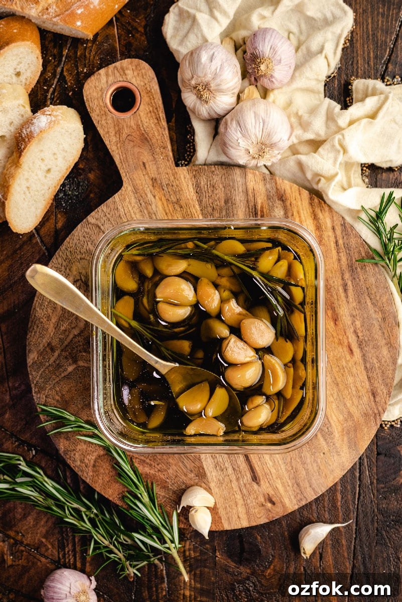 Garlic Confit and How to Make Homemade Garlic-Infused Oil 5 Garlic lovers rejoice: You can make homemade garlic confit and garlic oil with only a few minutes of prep time. Slowly roasting garlic cloves in olive oil allows them to become mild, caramelized, and tender enough to spread with a butter knife.