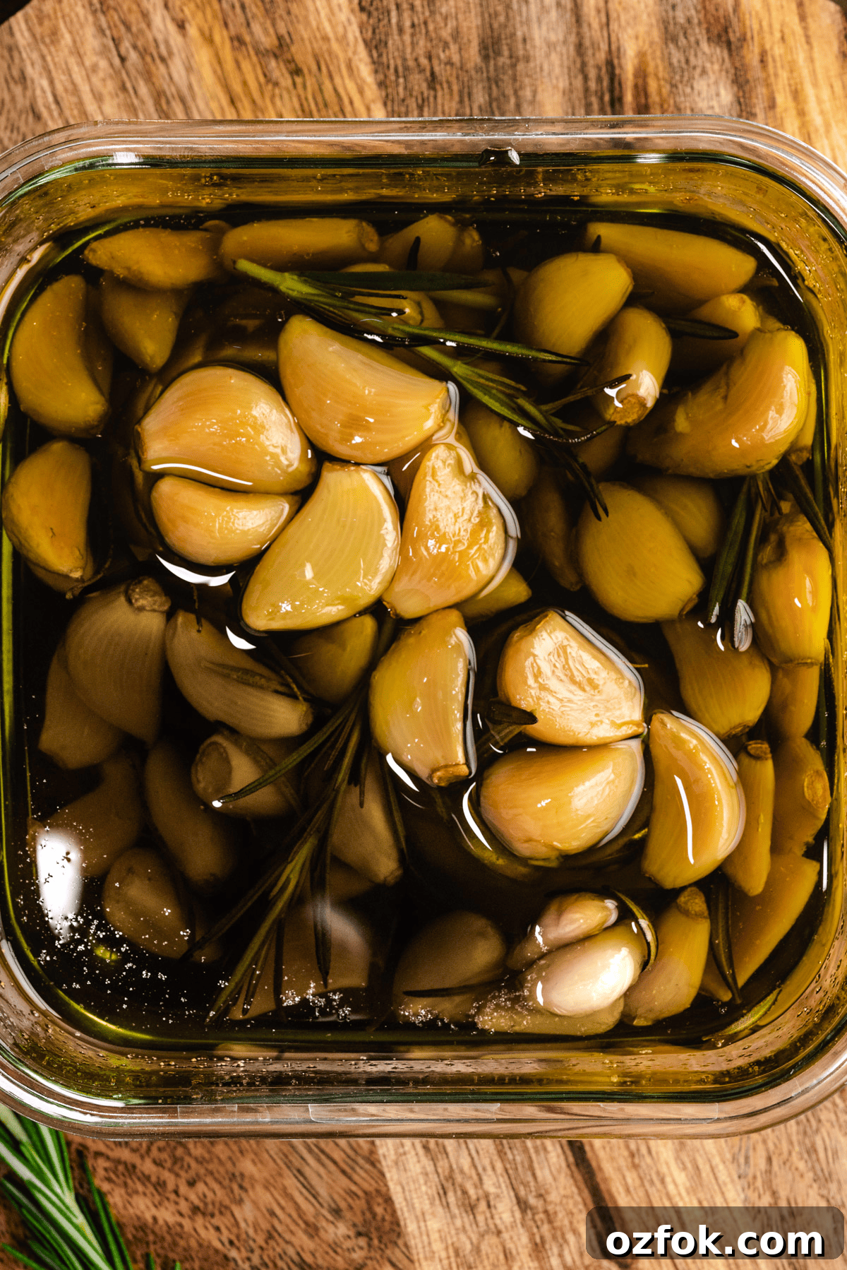 Garlic Confit and How to Make Homemade Garlic-Infused Oil 6 Garlic lovers rejoice: You can make homemade garlic confit and garlic oil with only a few minutes of prep time. Slowly roasting garlic cloves in olive oil allows them to become mild, caramelized, and tender enough to spread with a butter knife.
