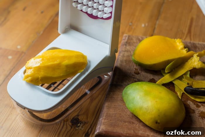 Mojito Fruit Salad Dressing Recipe: Fresh Lime & Mint Vinaigrette 3 Mojito Fruit Salad Dressing chopping a mango fruit with an oxo good grips vegetable chopper