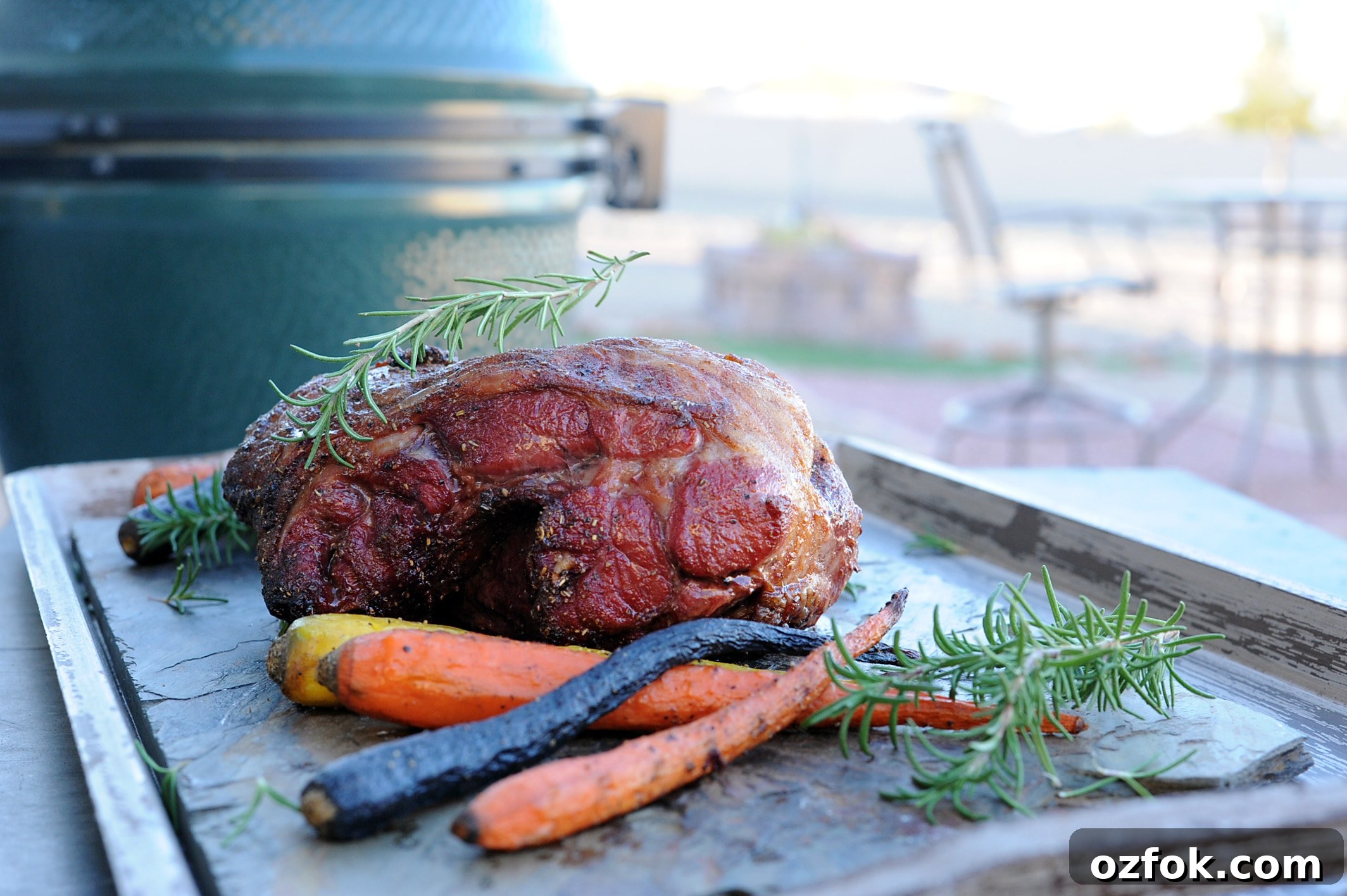 Grilled Australian Leg of Lamb Roast Recipe 8 Roasted leg of lamb setting on table with carrots by grill
