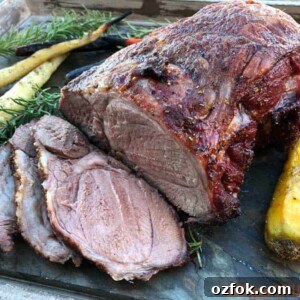 Grilled Australian Leg of Lamb Roast Recipe 9 sliced leg of lamb surrouned by carrots and rosemary