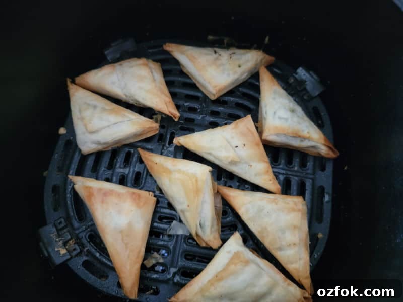 Air fried spanakopita in the air fryer basket