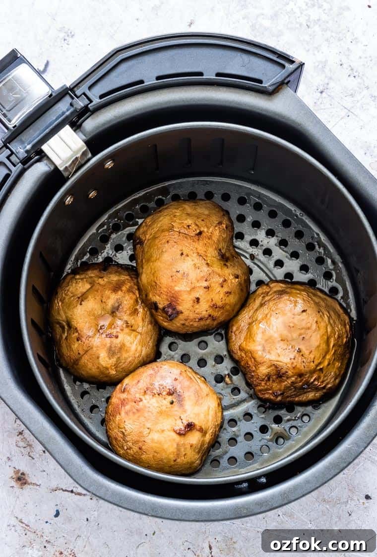 Garlic Mushroom Steak Recipe — Air Fryer & Grill (Vegan, Keto) 5 four garlic mushroom steaks inside the air fryer basket