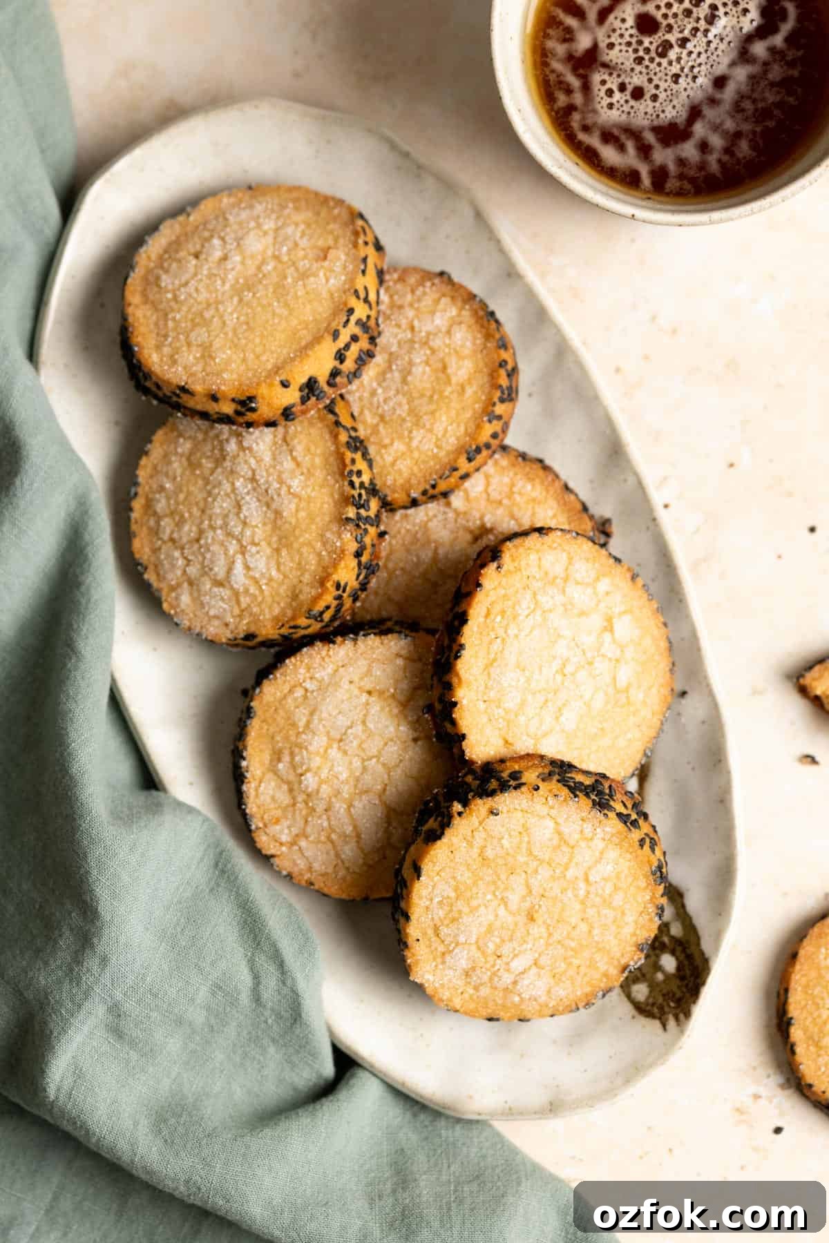Miso Brown Sugar Shortbread Cookies Recipe for Rich, Buttery Cookies 2 Top down view of a plate of miso shortbread cookies next to a green tea towel.