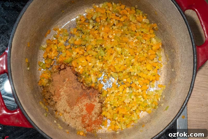 Moroccan Spiced Vegetarian Harira Soup Recipe for Cozy Meals 5 Adding the spices to the pot