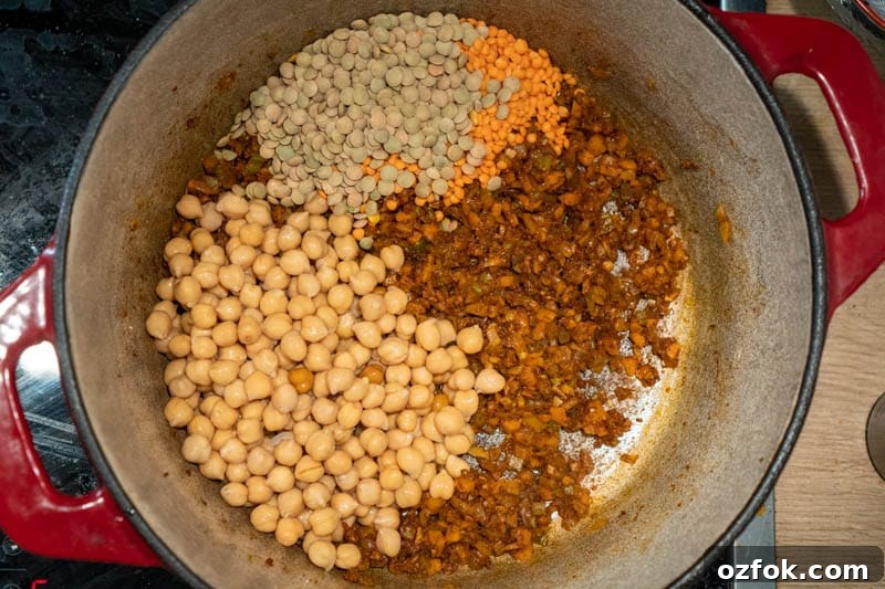 Moroccan Spiced Vegetarian Harira Soup Recipe for Cozy Meals 7 Adding the lentils and chickpeas to the pot