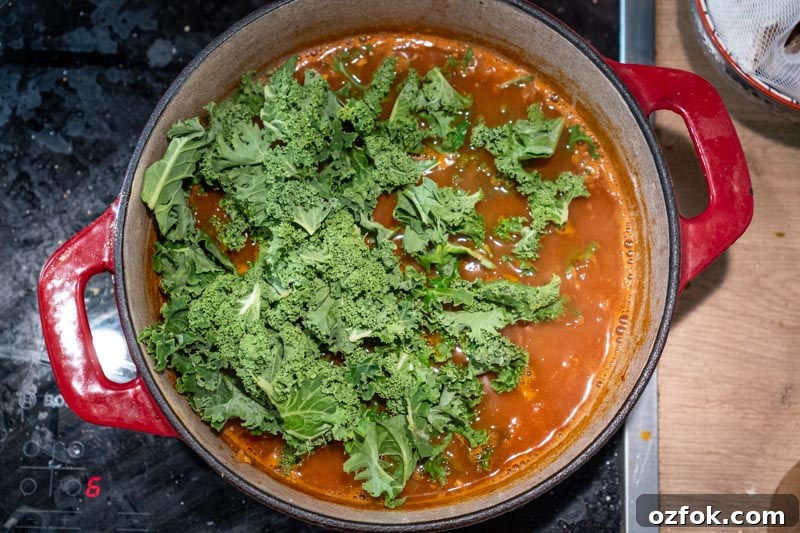 Moroccan Spiced Vegetarian Harira Soup Recipe for Cozy Meals 8 Adding the kale to the soup