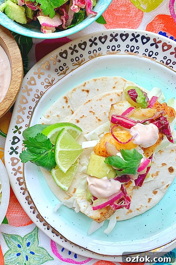 Authentic Baja Fish Tacos Guide: Flavorful Recipe & Tips 3 overhead view of open face fish taco garnished with lime