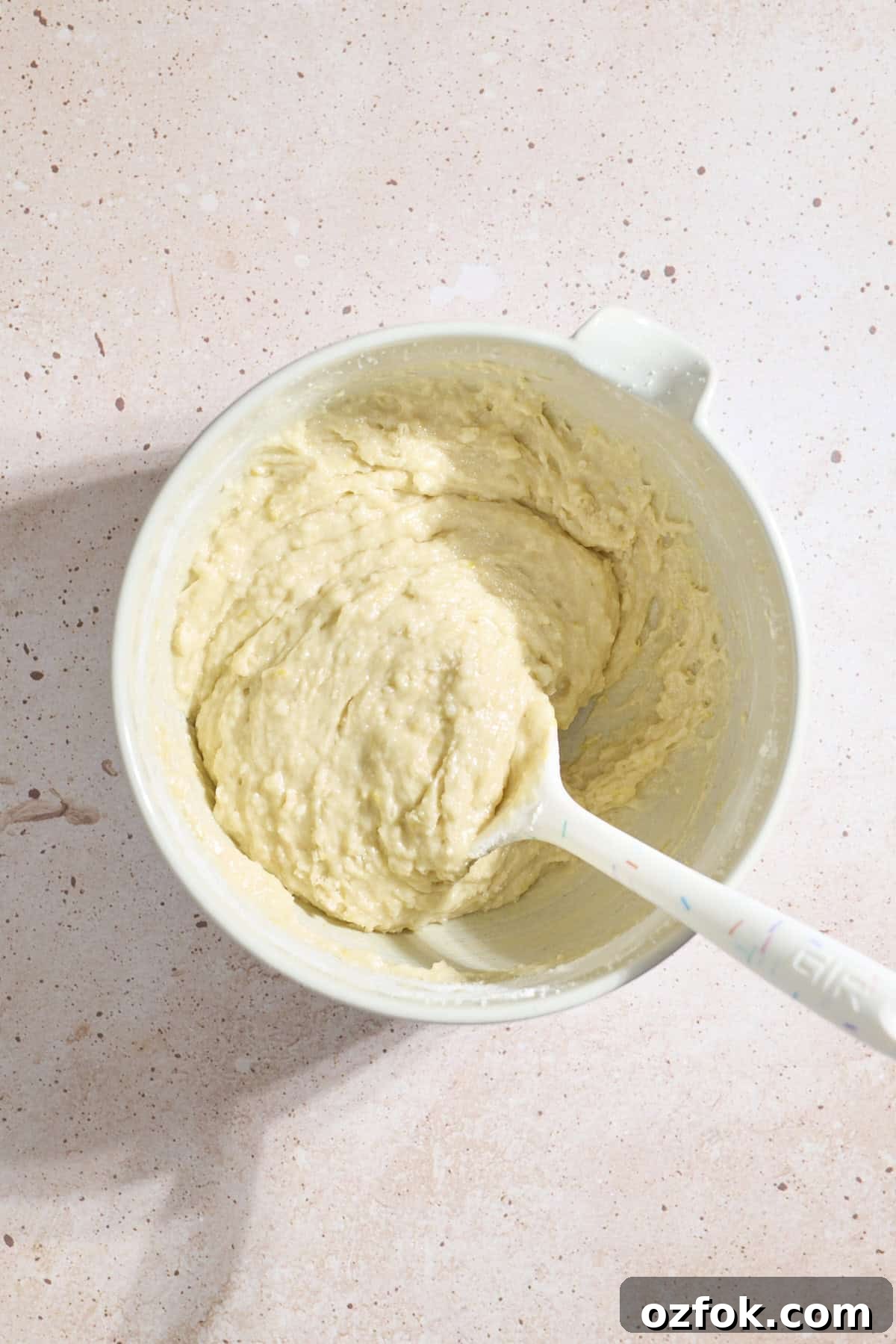 Cake batter in a large mixing bowl.