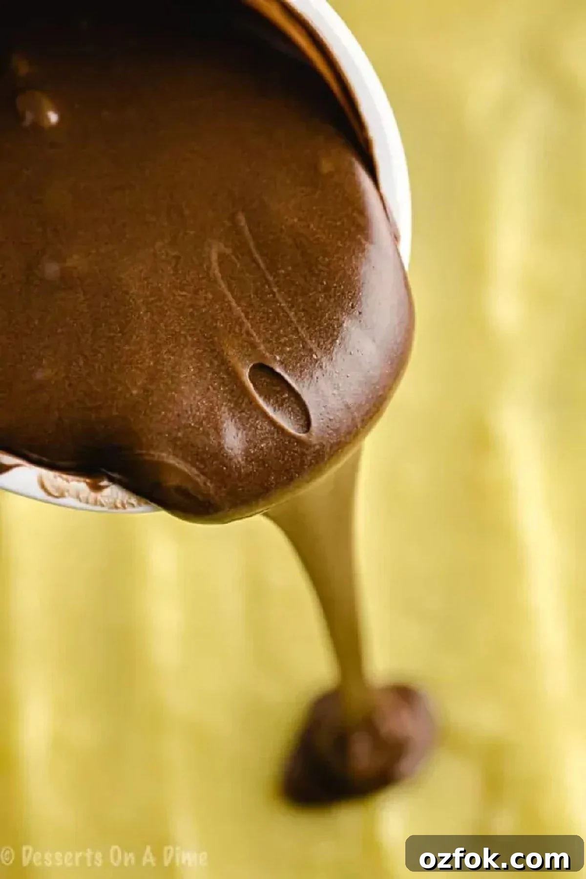 Boston Cream Poke Cake Recipe: Creamy Custard & Chocolate Drizzle 3 Chocolate frosted melted and poured over the pudding layer.