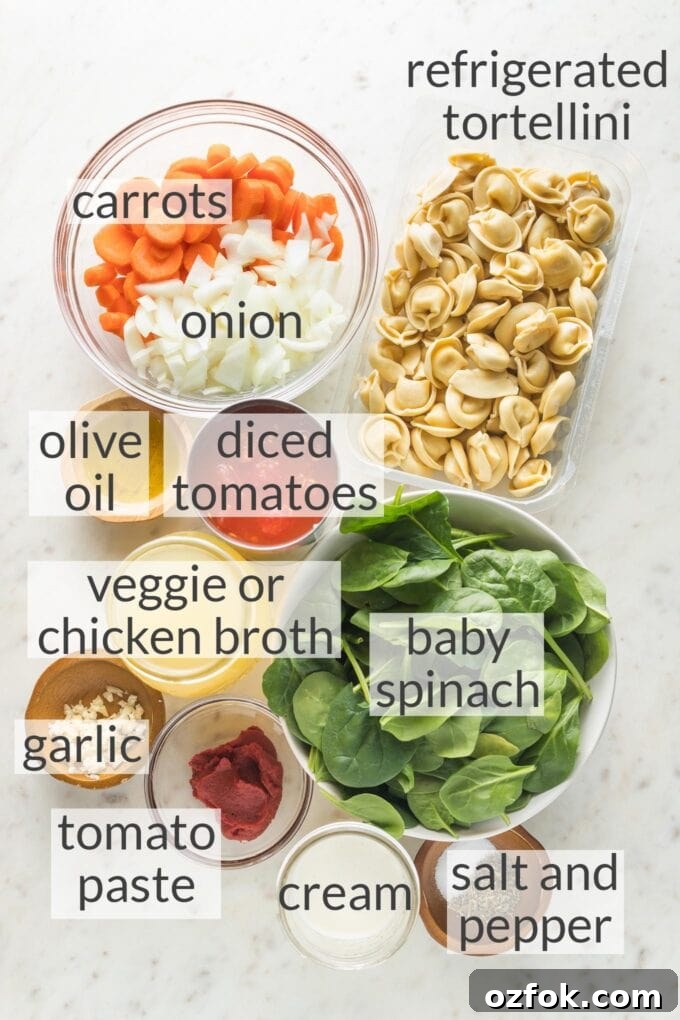 Prep bowls filled with refrigerated tortellini, carrots, onion, olive oil, diced tomatoes, baby spinach, broth, garlic, tomato paste, cream, salt and pepper.