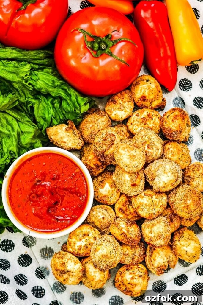 tortellini on plate with marinara sauce in a bowl