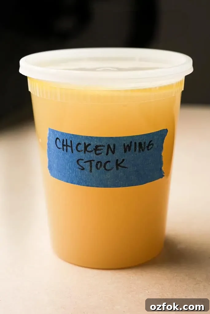 How to make chicken stock A sealed plastic container containing chicken wing broth.
