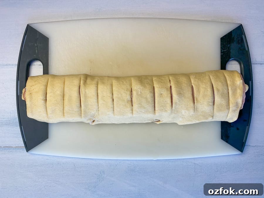 Slice ham roll-up into 12 equal sized pieces