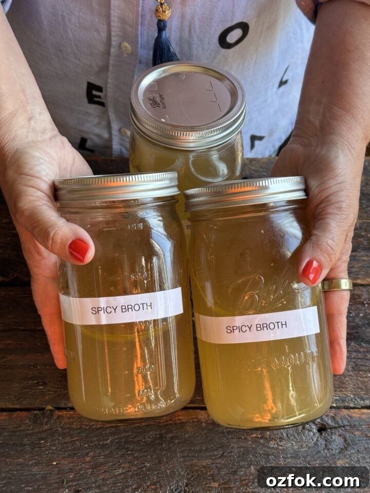 Spicy Chicken Soup Recipe: Flavorful Homemade Chicken Stew 13 a photo of spicy chicken stock in two mason jars