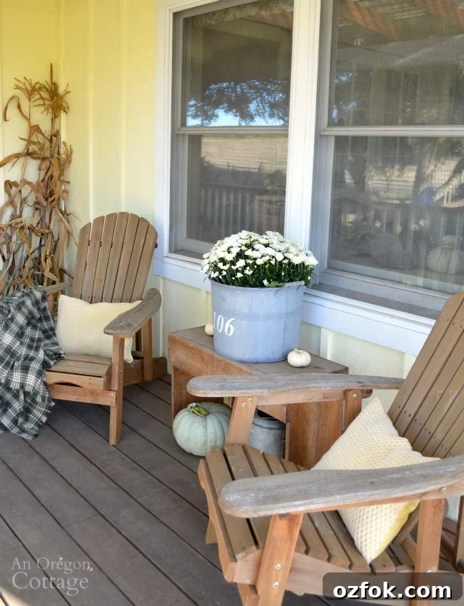 Natural Neutral Fall Porch Decorating Ideas for Cozy Curb Appeal 11 Fall Porch with easy Adirondack chair fall decor