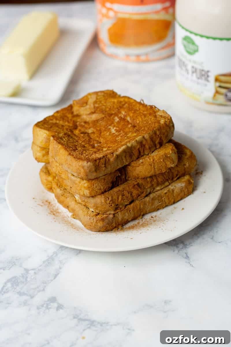 Pumpkin Spice French Toast Recipe for Fall Brunch 5 Pumpkin French Toast Recipe Stacked on White Plate