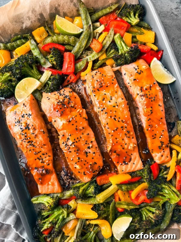 Greek Sheet-Pan Chicken with Tangy Feta and Roasted Veggies 11 Teriyaki salmon with veggies on a sheet pan.