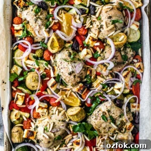 Greek Sheet-Pan Chicken with Tangy Feta and Roasted Veggies 15 Overhead shot of sheet pan covered with roasted veggies, chicken, and feta.